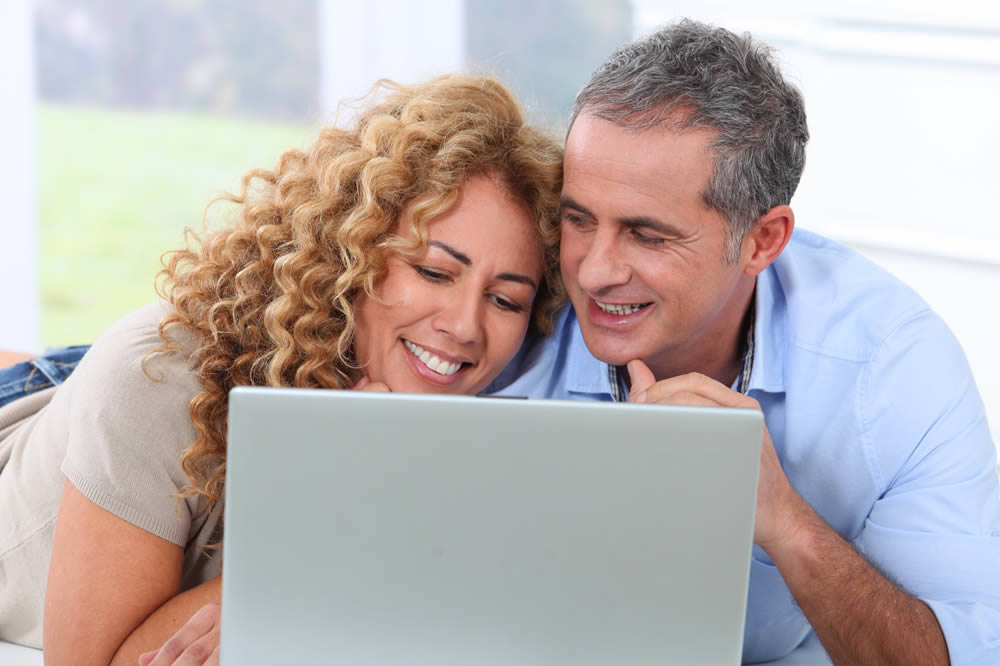 Photo of Couple and Computer